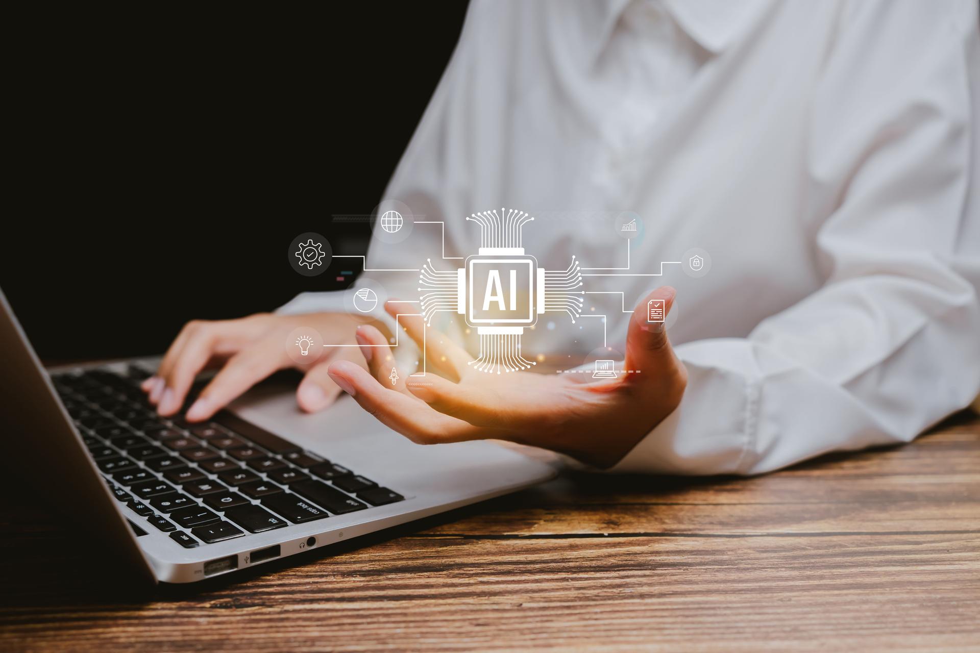 Person Using Laptop with AI Technology and Digital Graphics, Business concept.